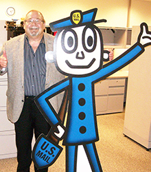 Oklahoma District Marketing Manager Mark Waugh poses with Mr. ZIP.