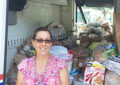 Hudson, FL, Rural Carrier Kim Durocher collects food on her route.