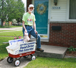Chet Kilanowski, a retired letter carrier, gathers donations for the Roseville, MI, Post Office.