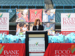 South Jersey Sr. Post Office Operations Manager Ronelle Mihok speaks at a food drive kickoff at Campbell's Field in Camden, NJ.
