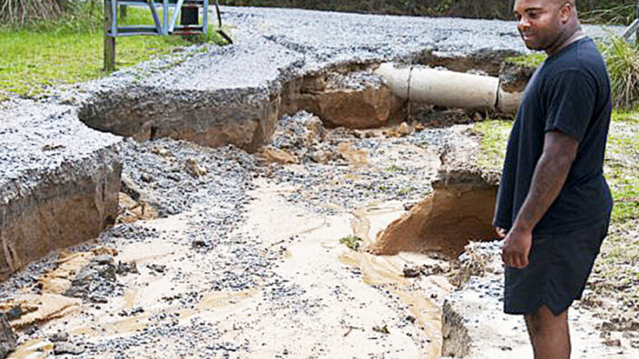 Eastover, SC, resident Marcus Bostic surveys the damage to his driveway this week.