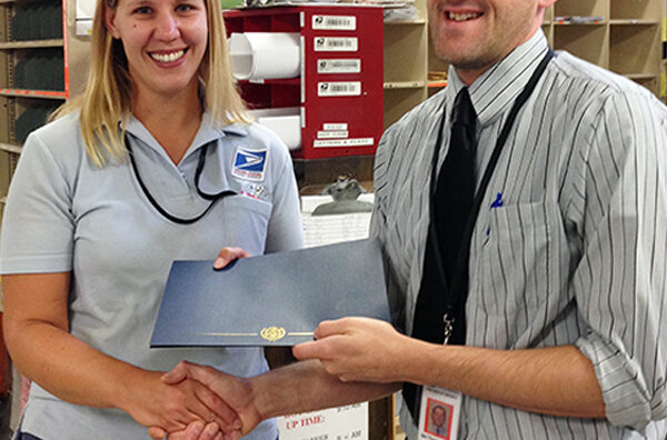 Wellsville, NY, Letter Carrier Kelly Chapman and Customer Services Supervisor Ian Thompson