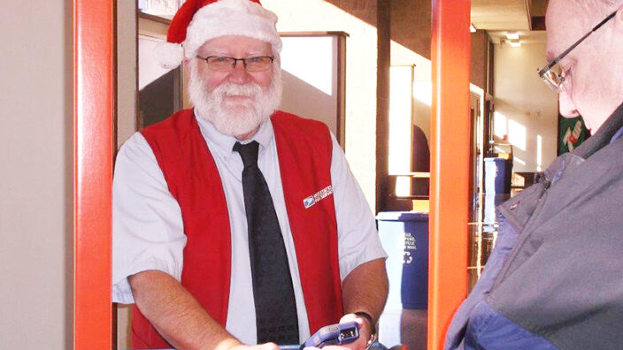 La Crosse, WI, Retail Associate Larry Potter serves a customer in December.