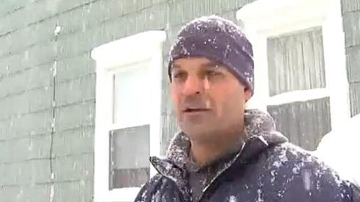 A TV news report shows Syracuse, NY, Letter Carrier Matthew Bregande braving snowy weather.