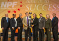 The presentation of best new project award to Central Plains District included, from left, Williams, Harrington, Sigmon, District Manager Rick Pivovar, Western Area Operations Support Manager Erica Brix, Western Area Acting VP Greg Graves, Malone and Phelan.