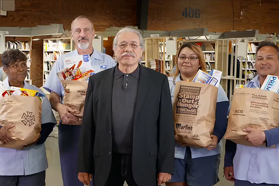 Actor Edward James Olmos and several USPS employees.