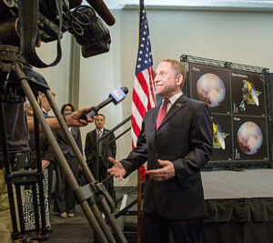 Alan Stern, principal investigator of the New Horizons mission, speaks to reporters at the dedication ceremony.