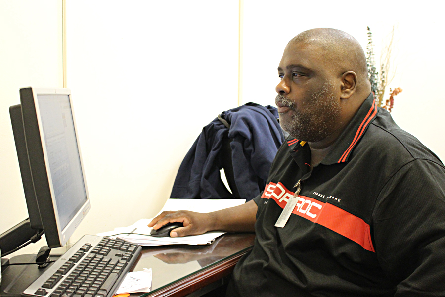 Chicago Letter Carrier James Robinson reviews records in a database, part of a project to boost efficiency.