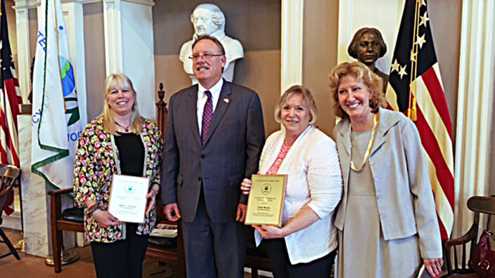 Present at the recent awards ceremony were Julie Theroux; Curt Spalding, an EPA administrator; Hinsdale, NH, Postmaster Cindy Mason; and Anne Fenn, an EPA program manager.