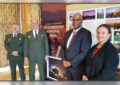 Participants at the Yellowstone National Park stamp dedication in Wyoming included, from left, Deputy Park Superintendent Steve Iobst, Park Superintent Dan Wenk, Colorado/Wyoming District Manager Selwyn Epperson and Yellowstone Postmaster Jamit Dalin.