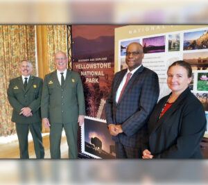 Participants at the Yellowstone National Park stamp dedication in Wyoming included, from left, Deputy Park Superintendent Steve Iobst, Park Superintent Dan Wenk, Colorado/Wyoming District Manager Selwyn Epperson and Yellowstone Postmaster Jamit Dalin.