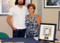 Photographer Paul Marcellini, whose image appears on the Everglades National Park stamp, stands with Customer Relations Coordinator Mirtha Uriarte at the stamp’s dedication in Miami.