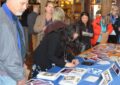 Stamp collectors line up to get postmarks at the Mount Rainier National Park stamp dedication in Paradise, WA.