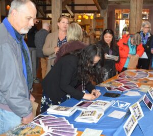 Stamp collectors line up to get postmarks at the Mount Rainier National Park stamp dedication in Paradise, WA.
