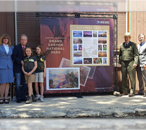 Participants at the Grand Canyon National Park stamp dedication in Arizona include Postmaster Christine Root, USPS Board of Governors Chairman James H. Bilbray and his granddaughters Molly Bilbray-Axelrod and Daisy Bilbray-Kohn, Grand Canyon National Park Commercial Services Chief Douglas Lentz and Chief Postal Inspector Guy Cottrell.