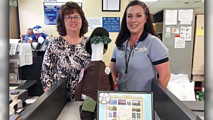 Surry, ME, Postmaster Debra Doyle and Retail Associate Sarah Nelson pose with Ghost Duck.