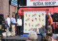 Participants at the Soda Fountain Favorites stamps dedication include, from left, Skip Bibb, owner of Elliston Place, the Nashville soda shop that hosted the ceremony; Employee Resource Management VP Nancy Rettinhouse; local television meteorologist Lelan Statom; and guest speaker Tommy Cole, a longtime soda shop customer.