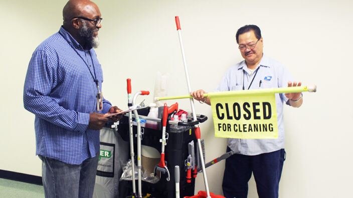 Carol Stream, IL, Maintenance Operations Supervisor Freeland Gogins and Custodian JoJo Francisco inspect tools created for the new Custodial Team Cleaning program.