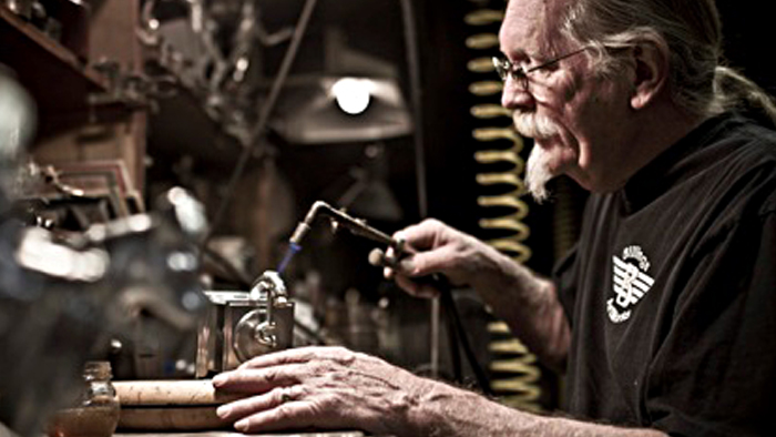 John Billings, an enthusiastic USPS customer, crafts a Grammy Award.