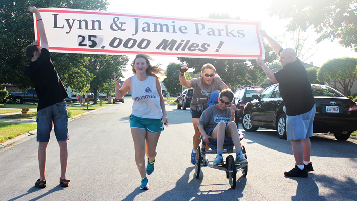 Annalyn, Jamie and Lynn Parks cross the finish line on their 25th anniversary running together earlier this month.