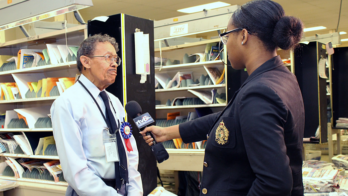 Indianapolis Letter Carrier Howard Stevenson is interviewed by a TV news crew this week.