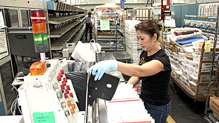 San Diego, CA, Clerk Beth Evangelista is one of many Pacific Area employees who are heling USPS prepare for the fall elections.