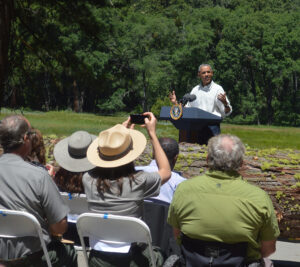 President Obama addresses an audience inside the park.