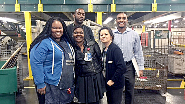 Employees who’ve helped Los Angeles District boost its Priority Mail overnight score include, from left, Postal Support Employee Clerk La’Tiera Atkins, Customer Service Acting Supervisor Jason Haywood, Distribution Operations supervisors Tamra Jenkins and Cherry Ngo, and Operations Industrial Engineer Jordan Tolson.