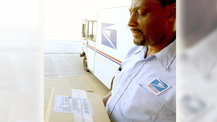 Cleveland Letter Carrier Marvin Reese holds a Parcel Select package this week.