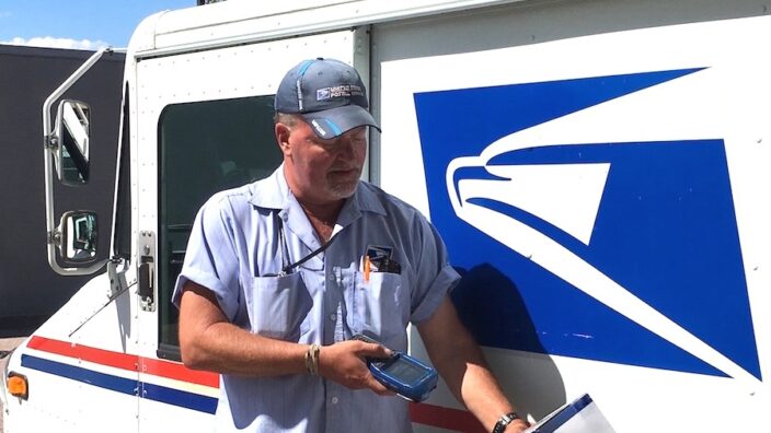 Colorado Springs, CO, Letter Carrier Todd Akers scans a package in Western Area, which led the nation in third-quarter scanning scores.