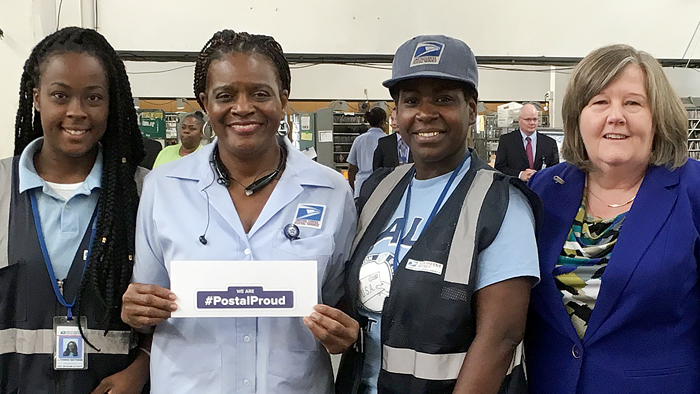 In Louisiana, City Carrier Assistant Alvinesha Matthews, Letter Carrier Bezeit Miles and City Carrier Assistant Lynika Walker receive praise from PMG Megan J. Brennan.