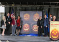 From left, St. Stephen’s Catholic School student Samantha Jenson, Anoka Area Chamber of Commerce President Peter Turok, Anoka County Historical Society Executive Director Rebecca Ebnet Mavencamp, U.S. Sen. Amy Klobuchar, Twin Cities Live Reporter Emily Engberg, Chief Financial Officer Joe Corbett, Minnesota Sen. Jim Abeler and stamp photographer Sally Andersen-Bruce.