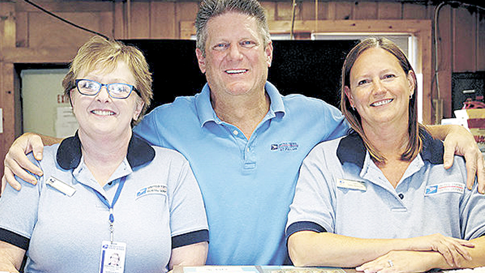 The Willernie Post Office’s three employees are, from left, Retail Associate Jaci Tennyson, Postmaster Steve Boughan and Retail Associate Julie Knoepke. Image: White Bear Press