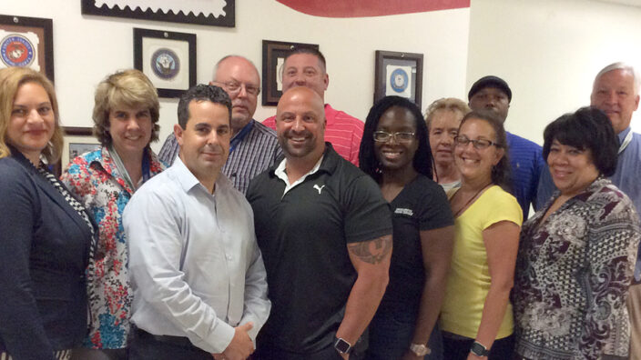 Western New York District employees gather to mark their Priority Mail success. From left: Stephanie Harris, Terri Burke, Lou Dileo, Don Newton, Joe Polidori, Joe Spagnola, Michele Brooks, Deb Fairand, Peggy Cocking, Wally Johnson, Shawntie Clark and Steven Russell.