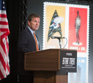 Chief Postal Inspector Guy Cottrell speaks at the Sept. 2 stamp dedication.