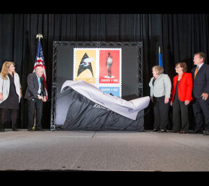Unveiling the stamps are, from left: NASA official Michelle Thaller, “Star Trek” star Walter Koenig, PMG Megan J. Brennan, CBS Consumer Products executive Liz Kalodner and Chief Postal Inspector Guy Cottrell.