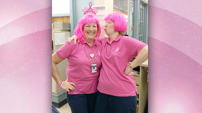 Trenton, SC, Postmaster Susan Curry, left, celebrates being a breast cancer survivor with Retail Associate Angela DeRemigio.