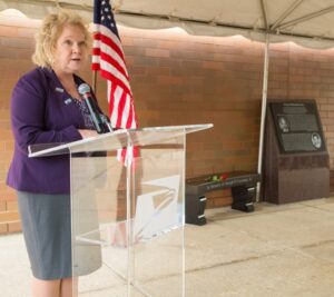 Capital Metro Area VP Linda Malone addresses the audience during the ceremony.