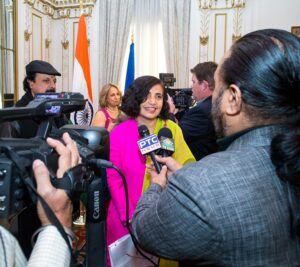 Mail Entry and Payment Technology VP Pritha Mehra is interviewed by the news media following the ceremony.