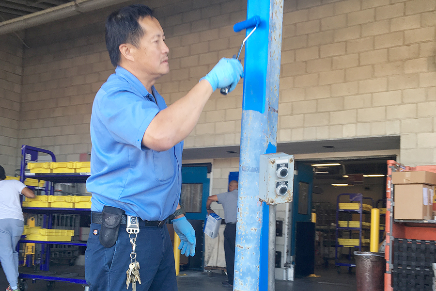 Maintenance Technician Tom Hong paints a dock at Westchester Station in Los Angeles last week.