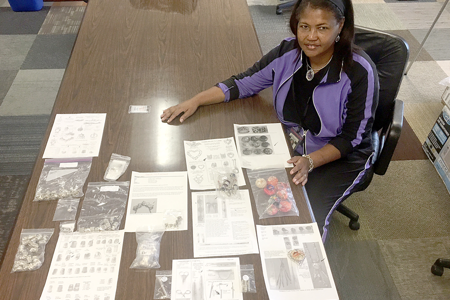Kim Wright, a clerk at the Mail Recovery Center in Atlanta, shows her valuable discovery.