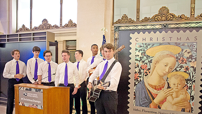 Members of the Eye Street Boys, a Washington, DC, area group, perform in front of the stamp image at the Oct. 18 dedication ceremony.