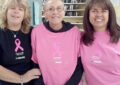 Onondaga, MI, Rural Carrier Peggy Clark, center, who is finishing treatment for breast cancer, celebrates with Postmaster Dawn Kibbey, left, and Rural Carrier Irene Lundy.