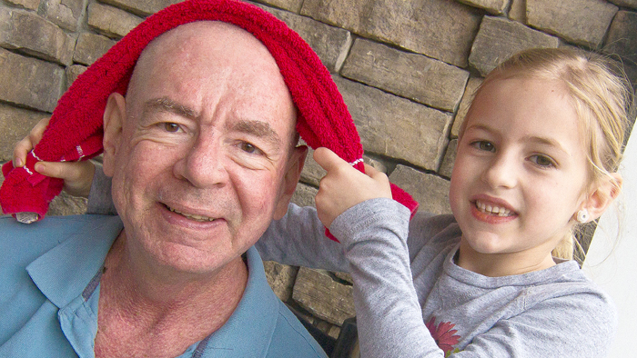 Sr. Public Relations Representative Mark Saunders shaved his head to show support for his granddaughter Eve, who beat bilateral Wilms tumor, a cancer of the kidneys.