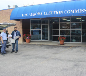 Aurora, IL, Letter Carrier Devin Broderick and City Carrier Assisant Javier Oropeza deliver ballots and other mail to the local election commission.