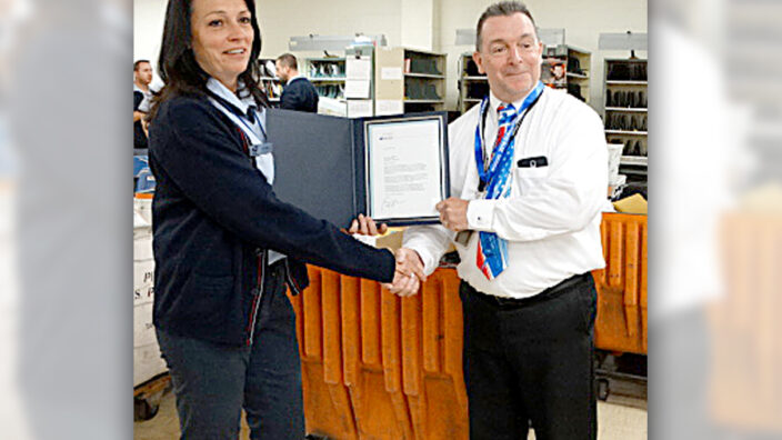 Lewiston, NY, Retail Associate Diana Whetstine and Postmaster Patrick Madigan