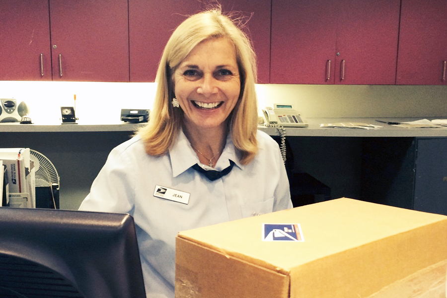 Providence, RI, Retail Associate Jean McCormick accepts a holiday package in December 2014.