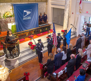 The Postal Inspection Service Honor Guard presents the colors during the ceremony.