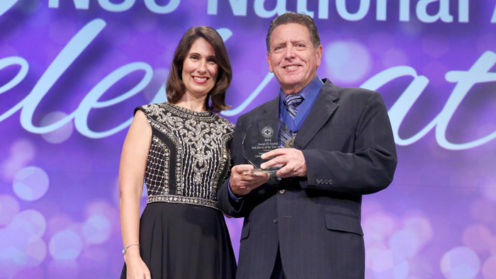 Deborah Hersman, the National Safety Council’s president and chief executive officer, presents the Joseph M. Kaplan Safe Driver of the Year Award to Brandon, FL, Letter Carrier Danny Ontengco recently.