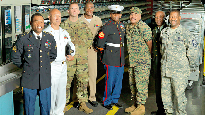 The many Postal Service employees who have served in the military include, from left, Joseph Tyler (Falls Church, VA, Post Office), U.S. Army; Generoso Cosio (Postal Police), U.S. Navy; Mitchell Carte II (Manassas, VA, Post Office), U.S. Army; Terrell Hill (Lanham, MD, Post Office), U.S. Navy; Damon Bailey (Washington, DC), U.S. Marines; Troy Keller (Arlington, VA, Post Office), U.S. Marines; Peter Miller (Bethesda, MD, Post Office), U.S. Army; and Gregory Suber (Laurel, MD, Post Office), U.S. Air Force.